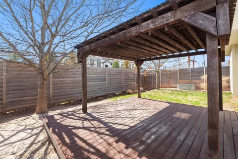 a view of backyard with wooden floor and roof