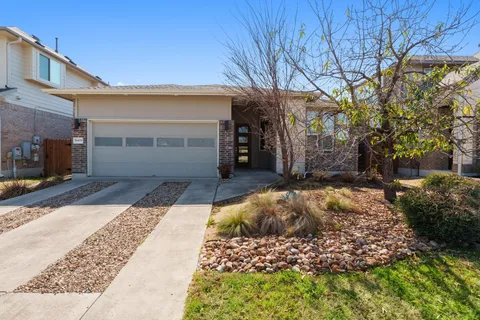 a view of a backyard of the house