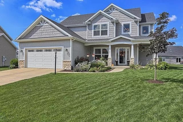 a front view of a house with a yard