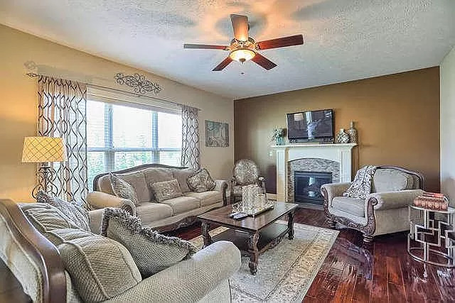 5102 Jacks Boulevard Champaign, IL 61822 - Photo 14 of 36 a living room with furniture fireplace and a flat screen tv