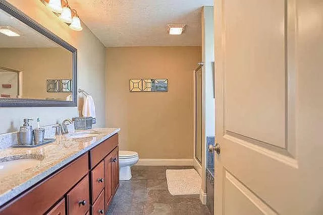 5102 Jacks Boulevard Champaign, IL 61822 - Photo 20 of 36 a bathroom with a granite countertop sink toilet and shower