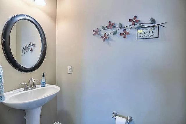 5102 Jacks Boulevard Champaign, IL 61822 - Photo 28 of 36 a bathroom with a sink and a mirror