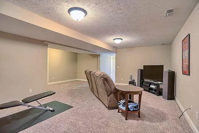 5102 Jacks Boulevard Champaign, IL 61822 - Photo 31 of 36 a work room with furniture and a flat screen tv