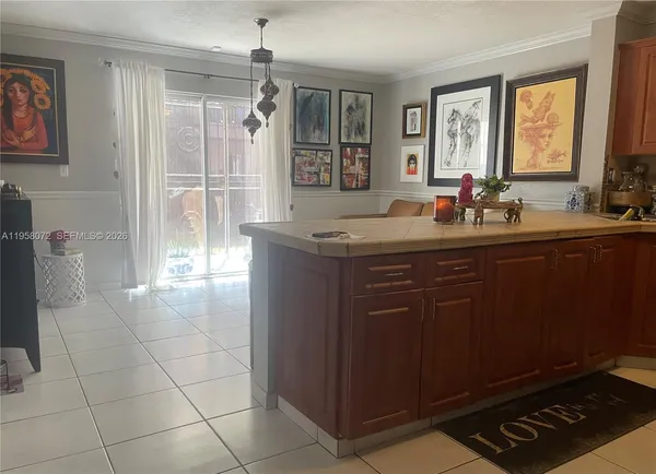 a kitchen with a sink a stove and a refrigerator