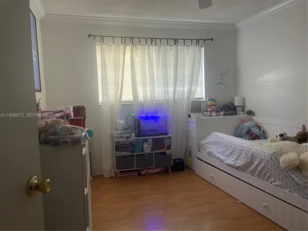 a bed room with a bed and a furniture