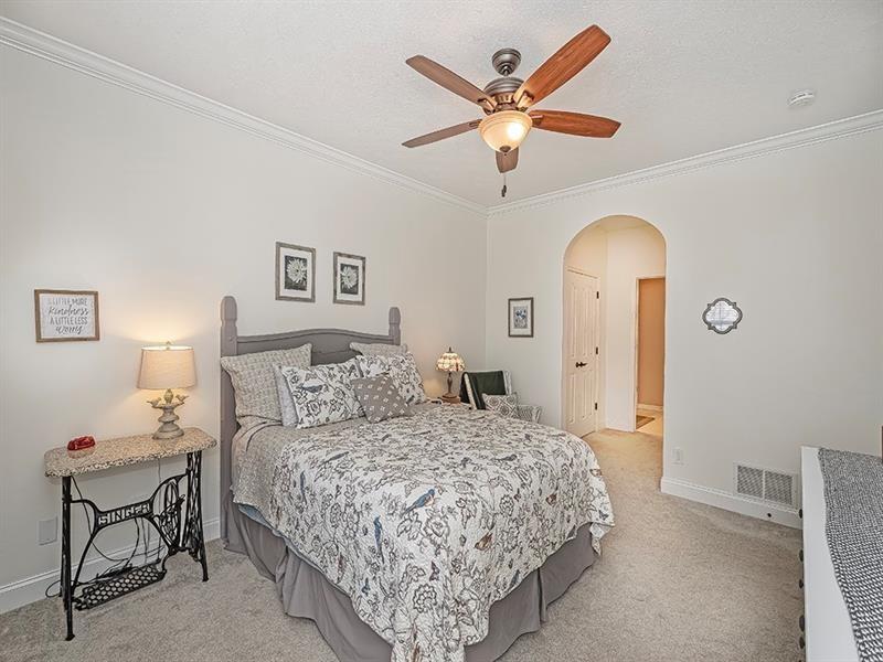 232 Adams Pointe Boulevard, Unit 6 Mars, PA 16046 - Photo 13 of 27 a bedroom with a large bed and a chandelier