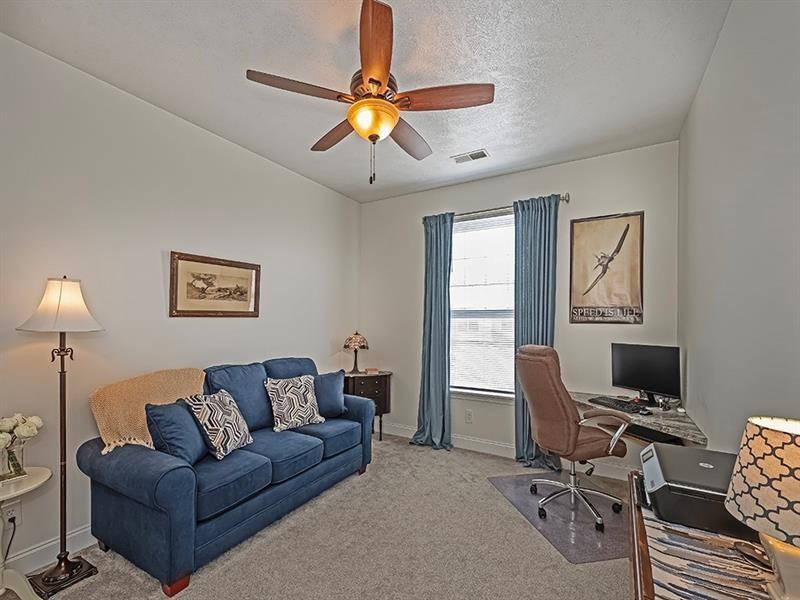 232 Adams Pointe Boulevard, Unit 6 Mars, PA 16046 - Photo 16 of 27 a view of a livingroom with workspace and a couch