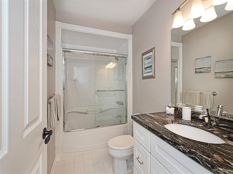 232 Adams Pointe Boulevard, Unit 6 Mars, PA 16046 - Photo 17 of 27 a bathroom with a granite countertop sink toilet and shower
