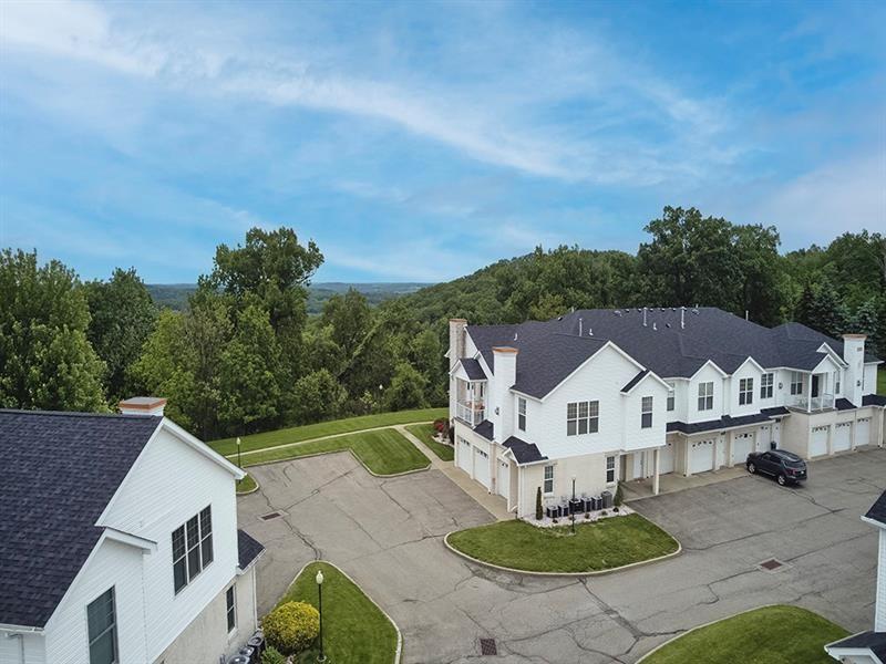 232 Adams Pointe Boulevard, Unit 6 Mars, PA 16046 - Photo 21 of 27 an aerial view of a house with a yard