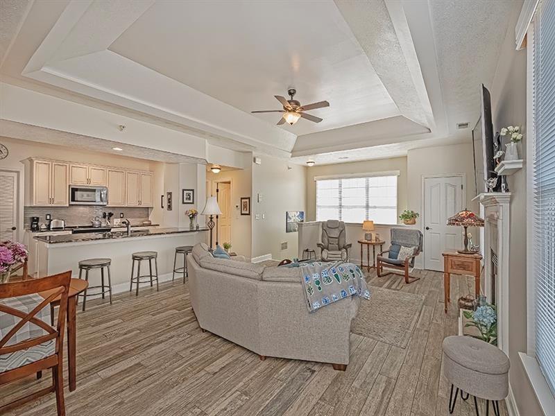 232 Adams Pointe Boulevard, Unit 6 Mars, PA 16046 - Photo 6 of 27 a living room with furniture dining table and a view of kitchen