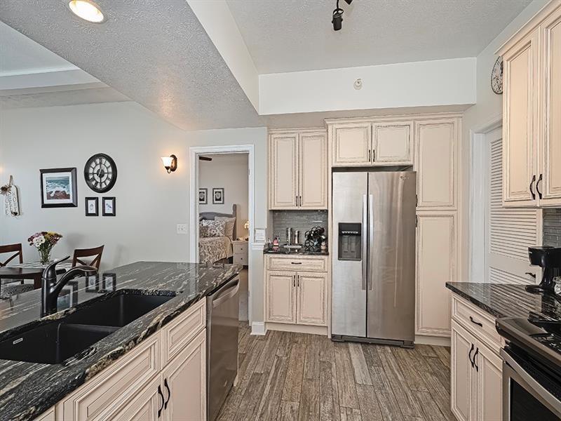 232 Adams Pointe Boulevard, Unit 6 Mars, PA 16046 - Photo 8 of 27 a kitchen with a sink stove and refrigerator