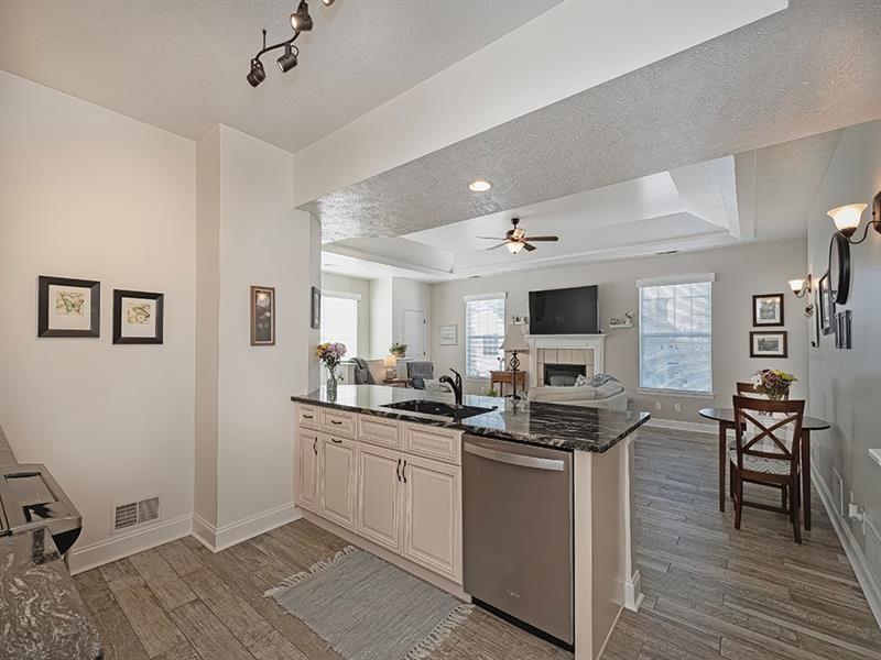232 Adams Pointe Boulevard, Unit 6 Mars, PA 16046 - Photo 9 of 27 a kitchen with granite countertop a sink appliances cabinets and furniture