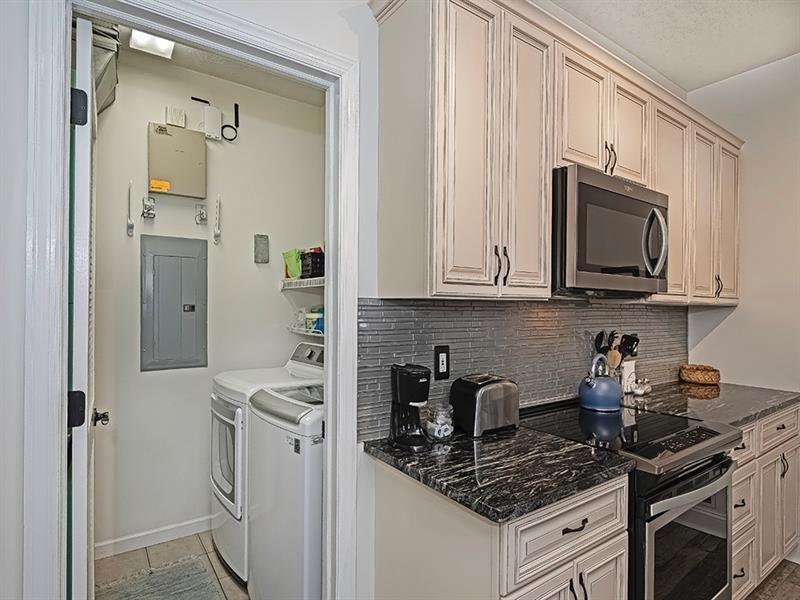 232 Adams Pointe Boulevard, Unit 6 Mars, PA 16046 - Photo 10 of 27 a kitchen with stainless steel appliances granite countertop white cabinets stove a sink and dishwasher