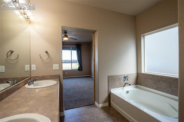 1985 Reed Grass Way Colorado Springs, CO 80915 - Photo 14 of 36 Primary 5 piece bathroom attached with walk in closet (main floor)