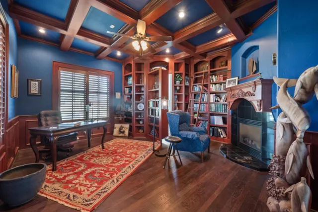 a view of a livingroom with furniture and a fireplace
