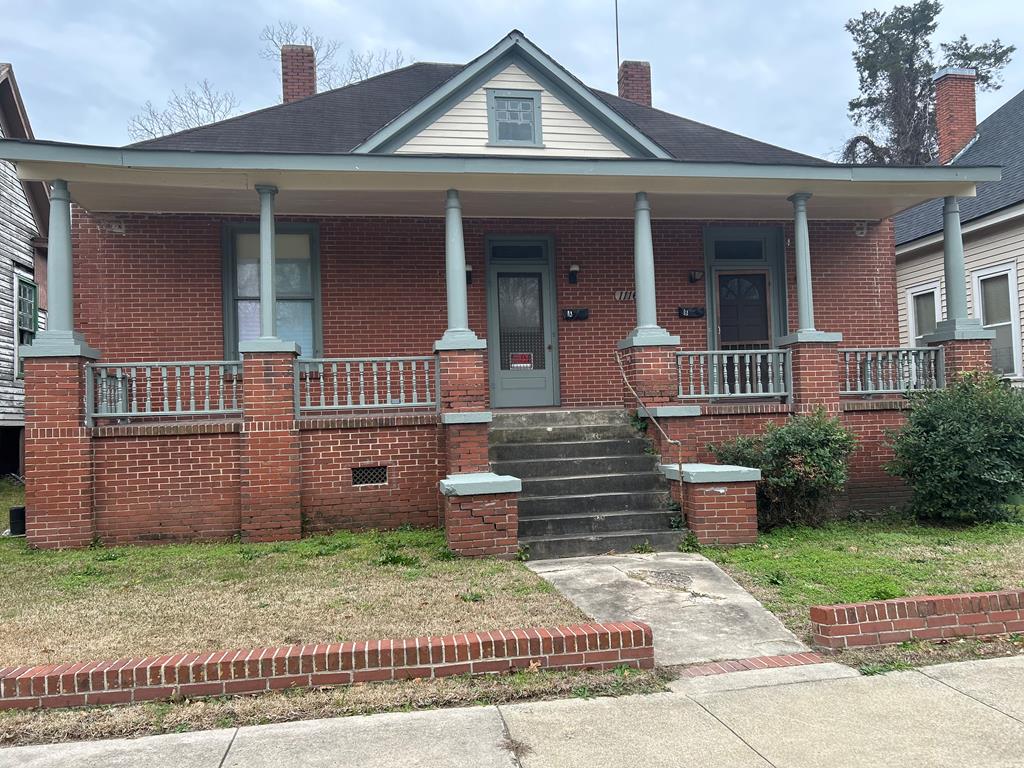 1116 18th Street Columbus, GA 31901 - Photo 1 of 1 a front view of a house with garden