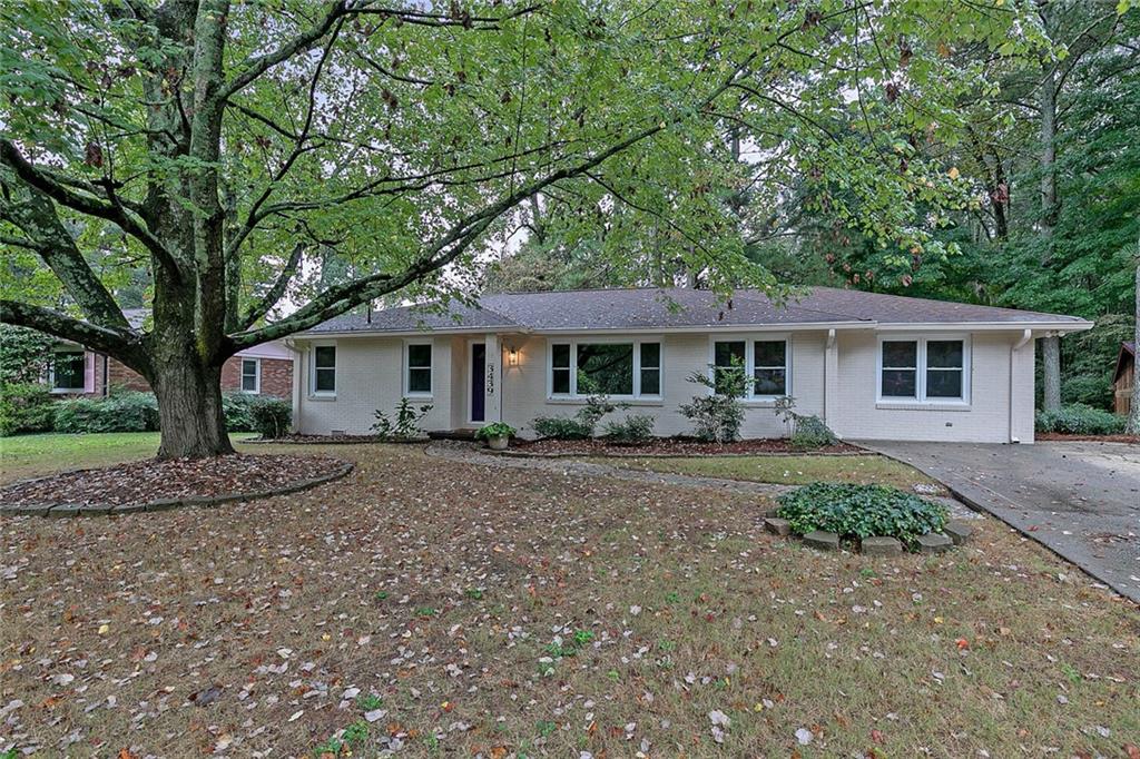 3439 Alcan Way Tucker, GA 30084 - Photo 1 of 1 a front view of a house with a garden