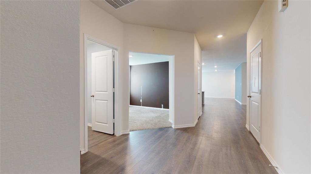 1616 Flt Rdg Court Royse City, TX 75189 - Photo 12 of 26 a view of a hallway with wooden floor