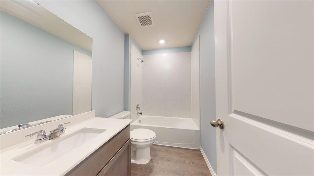 1616 Flt Rdg Court Royse City, TX 75189 - Photo 14 of 26 a bathroom with a sink a toilet and shower