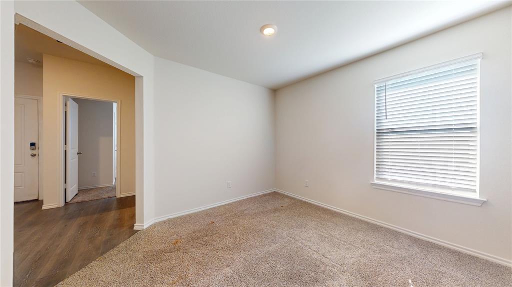 1616 Flt Rdg Court Royse City, TX 75189 - Photo 15 of 26 an empty room with wooden floor and windows