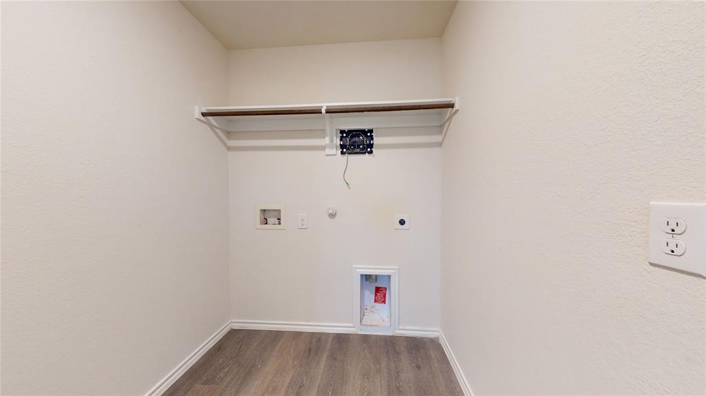 1616 Flt Rdg Court Royse City, TX 75189 - Photo 20 of 26 a view of a hallway with wooden floor