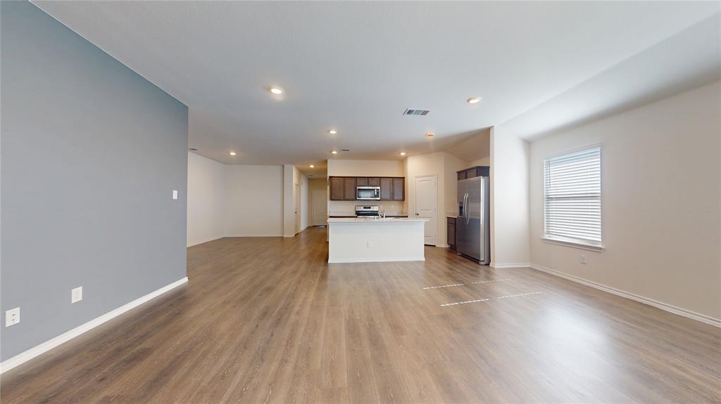1616 Flt Rdg Court Royse City, TX 75189 - Photo 8 of 26 a view of a kitchen with a sink and a refrigerator