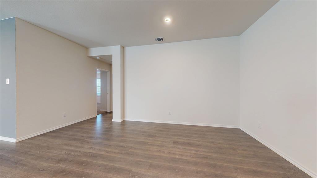 1616 Flt Rdg Court Royse City, TX 75189 - Photo 10 of 26 a view of an empty room with wooden floor