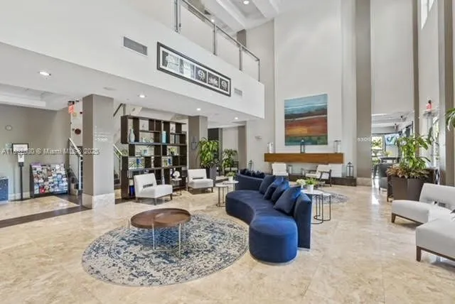 a living room with furniture and a table