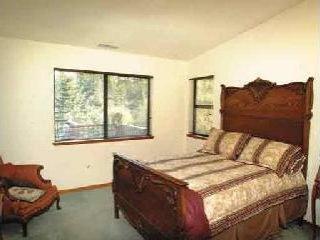 12210 Graton Road Sebastopol, CA 95472 - Photo 8 of 11 a bedroom with a bed window and couch