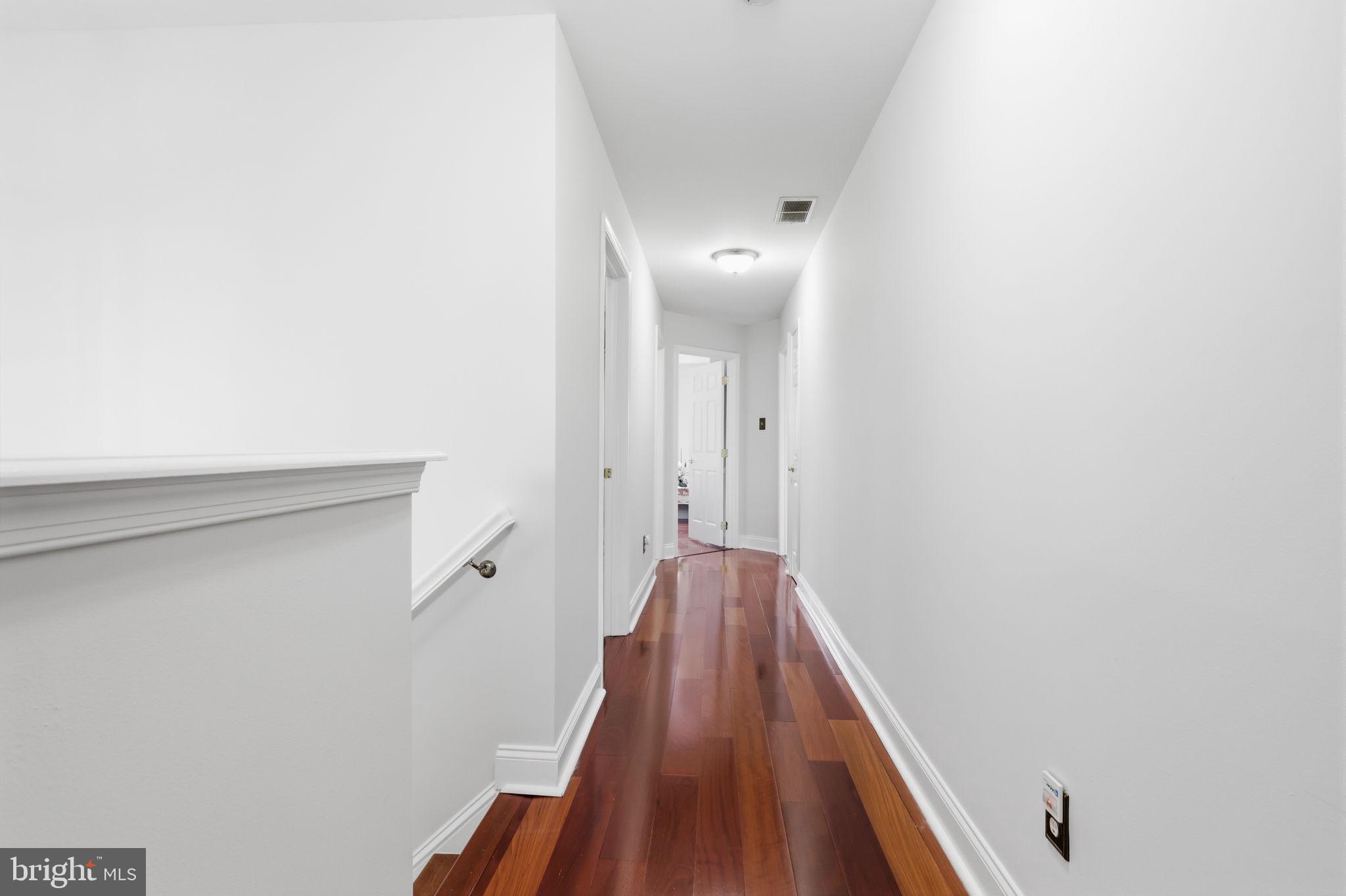 7 Wellington Road Newtown, PA 18940 - Photo 21 of 49 a view of a hallway with wooden floor