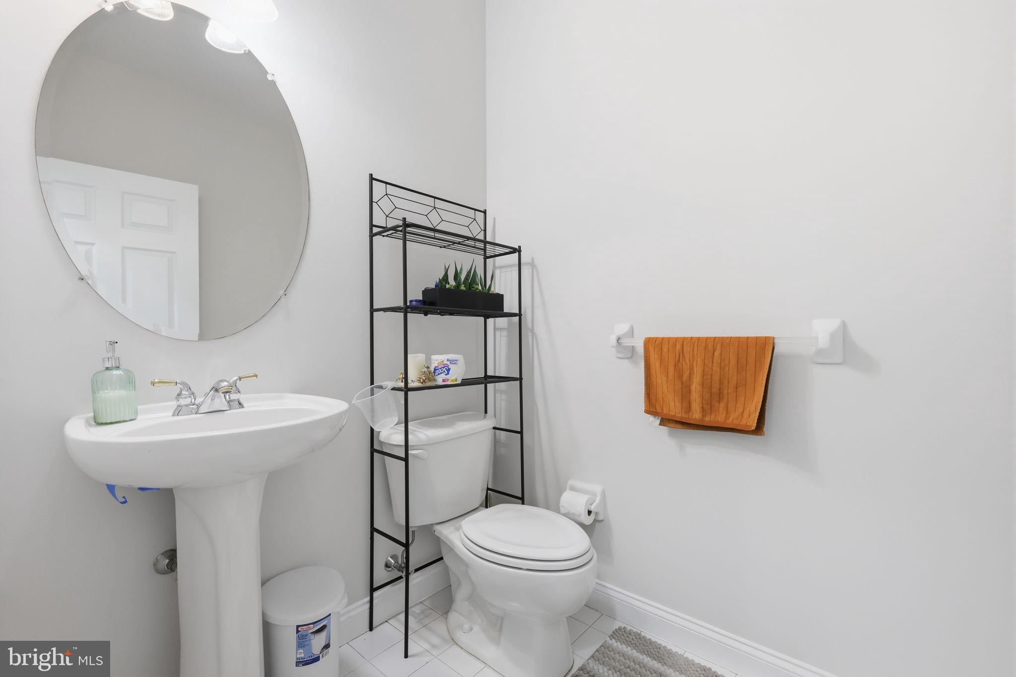7 Wellington Road Newtown, PA 18940 - Photo 9 of 49 a bathroom with a toilet sink and mirror