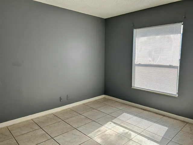 a white toilet sitting next to a bath tub shower