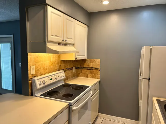 a view of a backyard with a swimming pool