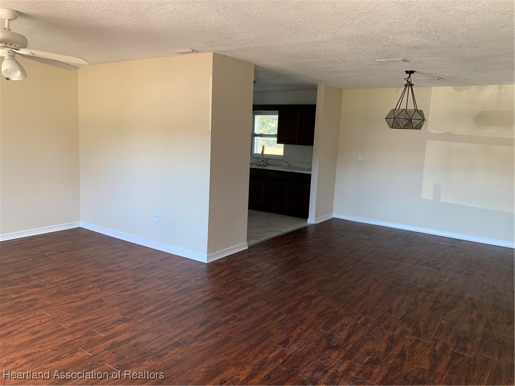 6101 Edgewater Terrace Sebring, FL 33876 - Photo 2 of 10 a view of a kitchen cabinets and wooden floor
