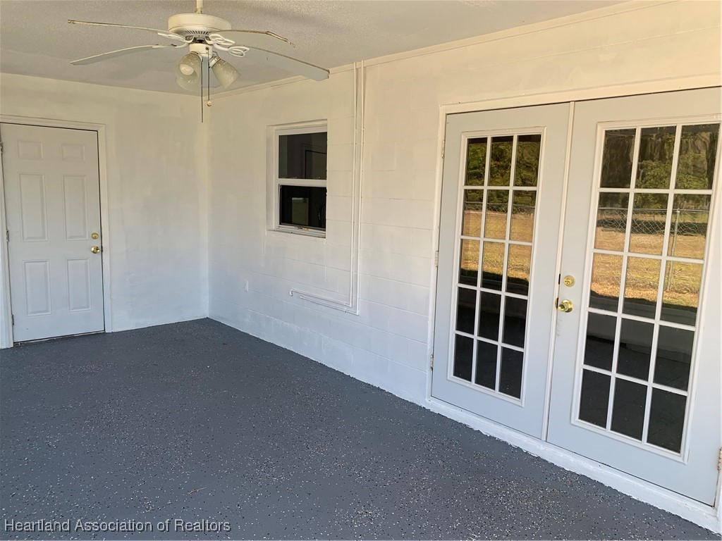 6101 Edgewater Terrace Sebring, FL 33876 - Photo 9 of 10 a view of empty room with windows