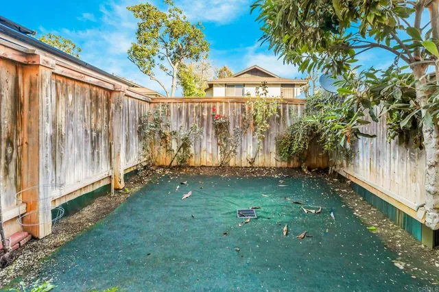 a view of a backyard with a garden