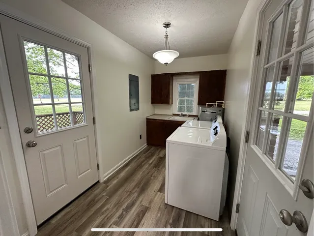 a view of living room with furniture and flat screen tv