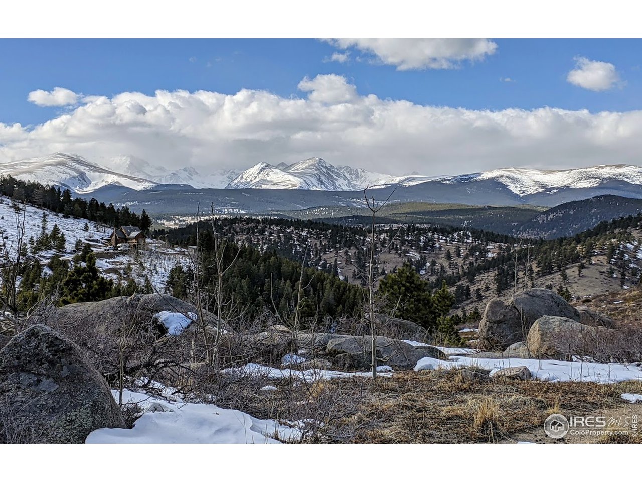 5280 Ridge Road Boulder, CO 80302 - Photo 3 of 19 a view of a town with mountains in the background