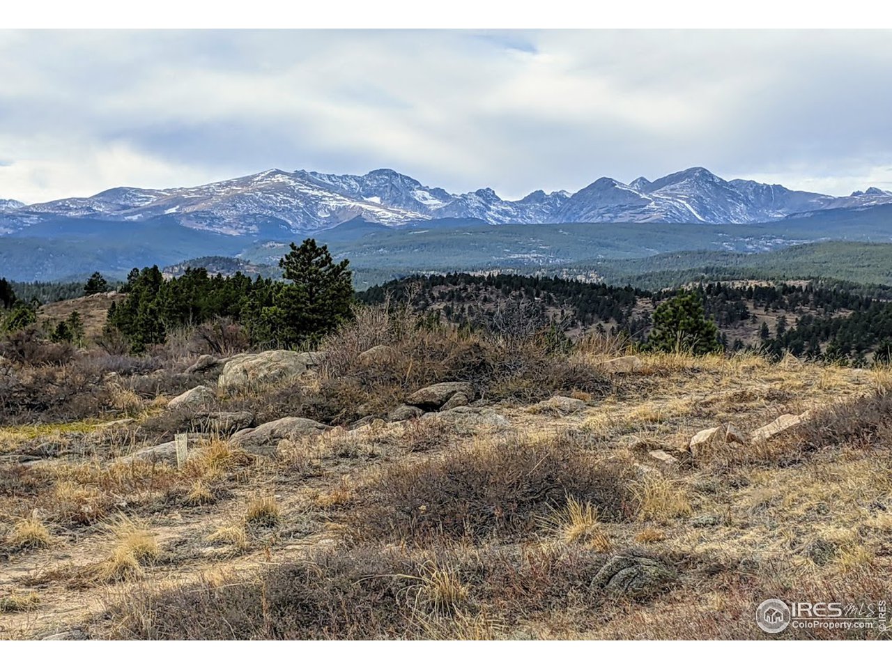 5280 Ridge Road Boulder, CO 80302 - Photo 8 of 19 a view of a lake with mountains in the background