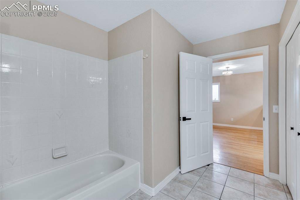 5125 Lewisia Point Colorado Springs, CO 80917 - Photo 16 of 32 a bathroom with a bathtub and shower