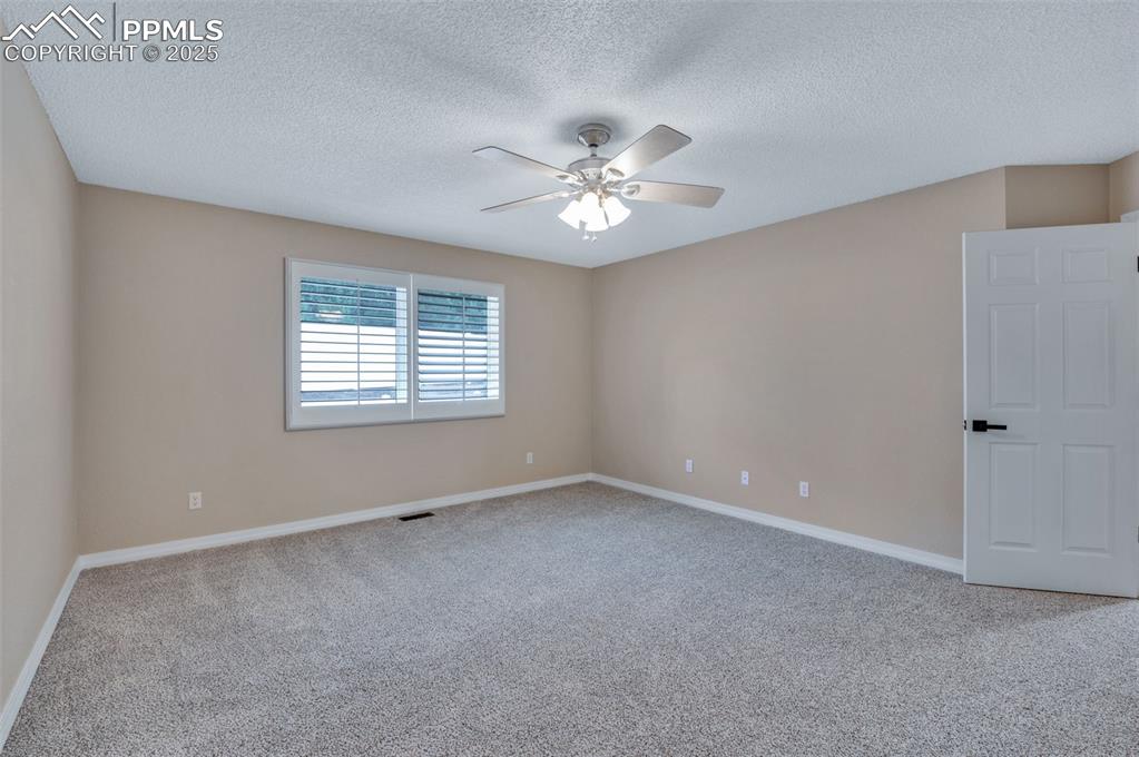 5125 Lewisia Point Colorado Springs, CO 80917 - Photo 18 of 32 a view of an empty room with a window