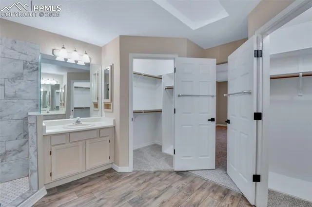 a bathroom with a sink and mirror