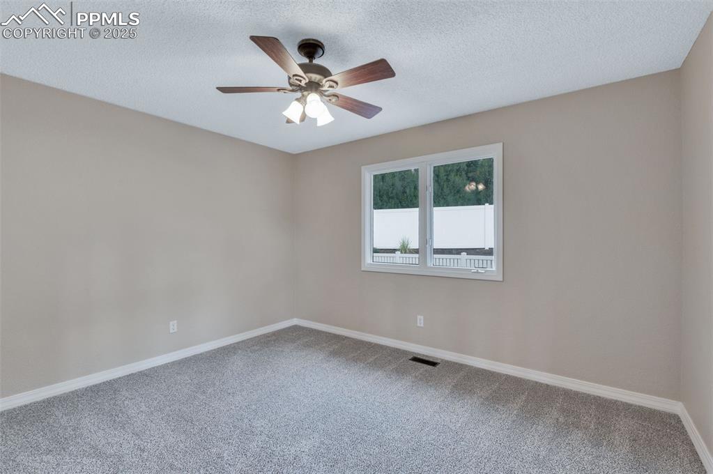 5125 Lewisia Point Colorado Springs, CO 80917 - Photo 25 of 32 an empty room with a window