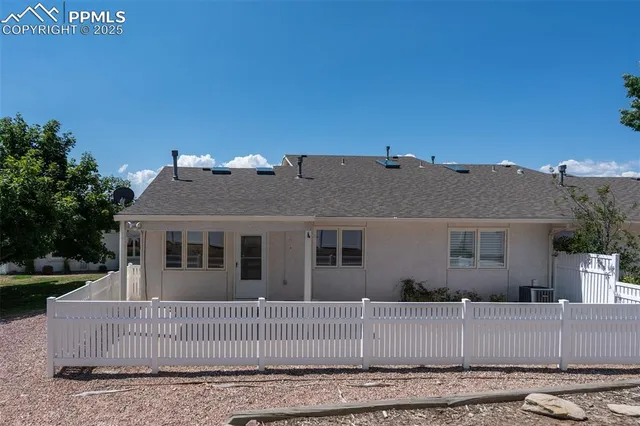 front view of a house with a bench