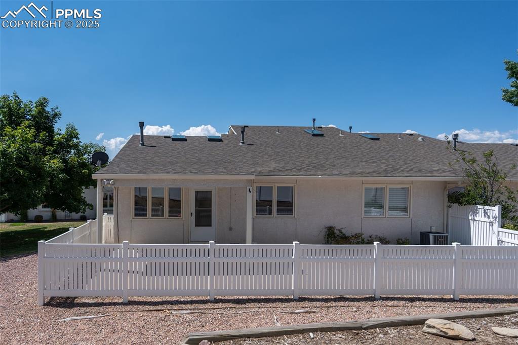 5125 Lewisia Point Colorado Springs, CO 80917 - Photo 28 of 32 front view of a house with a bench
