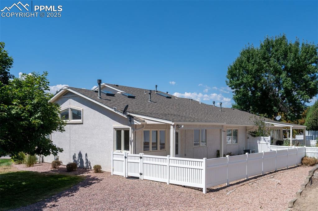 5125 Lewisia Point Colorado Springs, CO 80917 - Photo 30 of 32 a front view of a house with a yard
