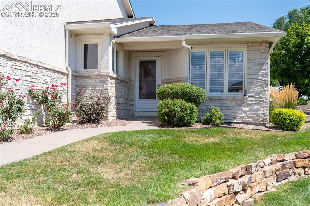 5125 Lewisia Point Colorado Springs, CO 80917 - Photo 3 of 32 a view of a house with a yard