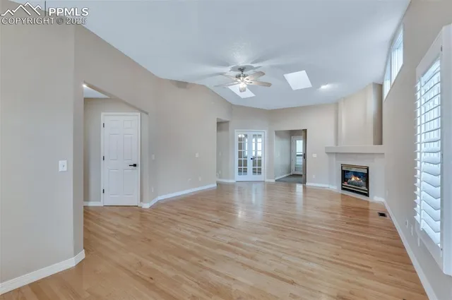 wooden floor in an empty room with a fireplace