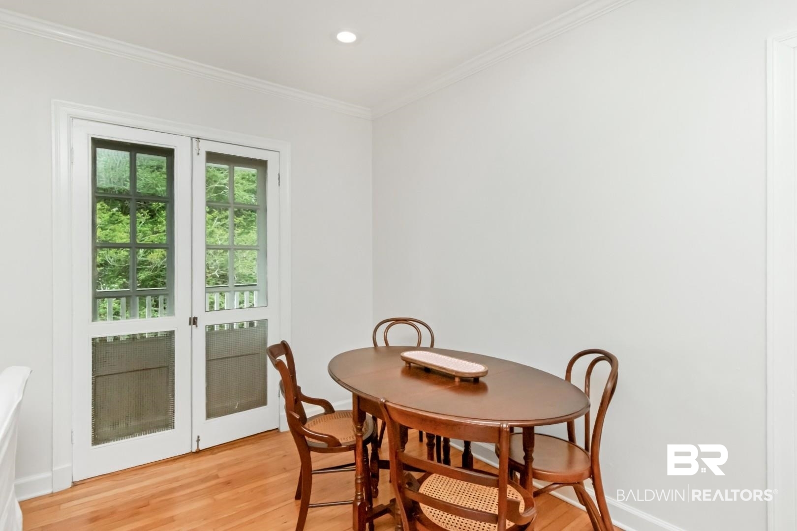 214 Upham Street, Unit 3D Mobile, AL 36607 - Photo 8 of 34 Dining space with light wood-style flooring, ornamental molding, and recessed lighting