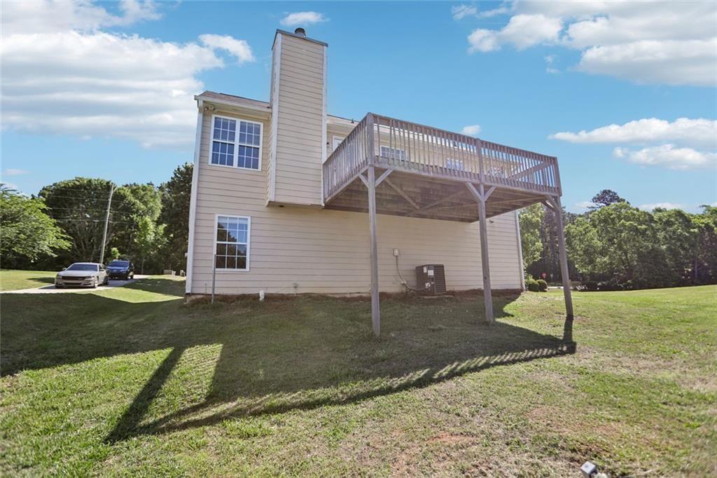 9720 Poole Road Villa Rica, GA 30180 - Photo 34 of 40 a view of a house with a yard